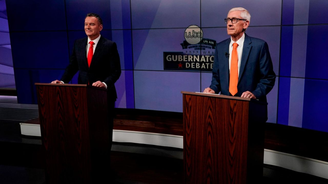 Wisconsin Gov. Tony Evers, right, and Republican challenger Tim Michels prepare for their debate in Madison on October 14, 2022.