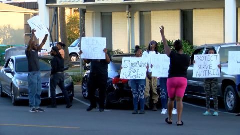 People protest in front of the Gulfport Police Department on October 11 after an officer shot and killed a teenager. 