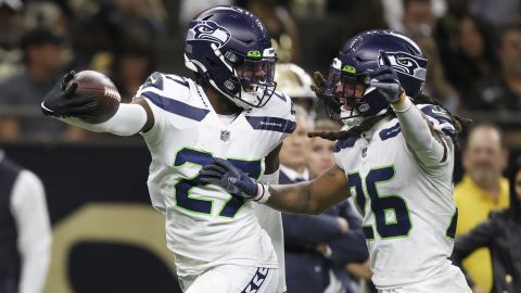 Tariq Woolen celebrates with Ryan Neal, after his interception of New Orleans Saints quarterback Andy Dalton's pass.