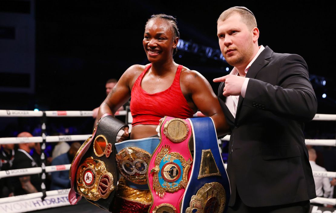 Shields celebrates victory with her belts after the WBO, WBA, IBO and WBF Women's Middleweight Title fight against Erna Kozin.
