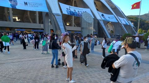 BTS fans queue outside Busan Asiada stadium to attend the band's free concert in South Korea on October 15, 2022. 