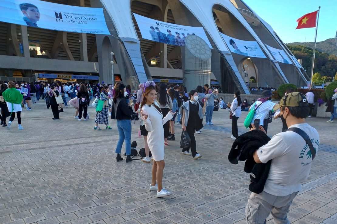 BTS fans queue outside Busan Asiada stadium to attend the band's free concert in South Korea on October 15, 2022. 
