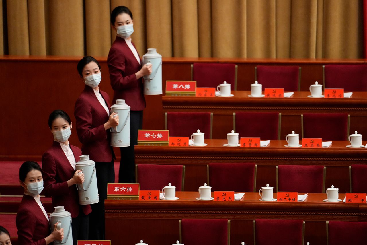 Hostesses prepare drinks at the Great Hall of the People.