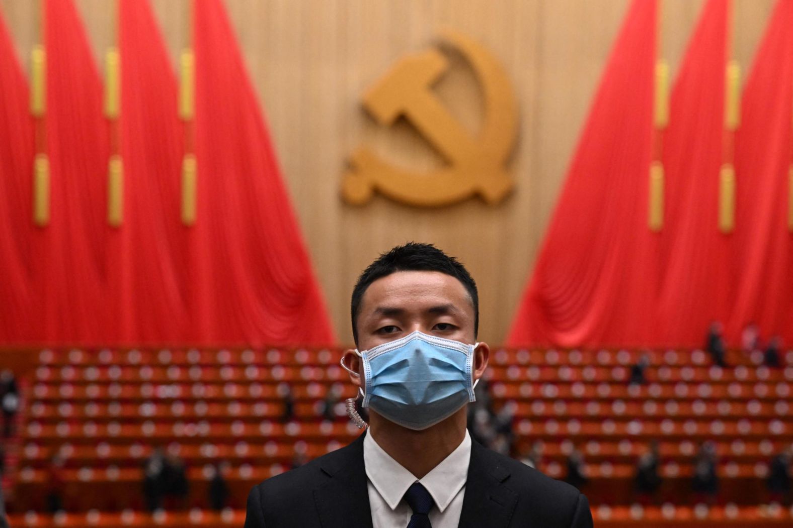 A security staff member keeps watch after the opening session.