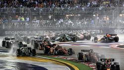 Red Bull Racing's Mexican driver Sergio Perez (R) leads at the start of the Formula One Singapore Grand Prix night race at the Marina Bay Street Circuit in Singapore on October 2, 2022. (Photo by ROSLAN RAHMAN / AFP) (Photo by ROSLAN RAHMAN/AFP via Getty Images)