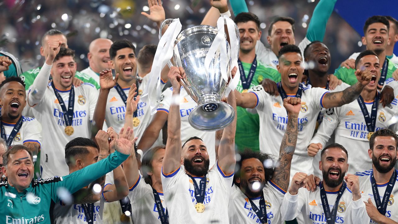 Benzema lifts the UEFA Champions League trophy after Real Madrid beat Liverpool in the final last season. 