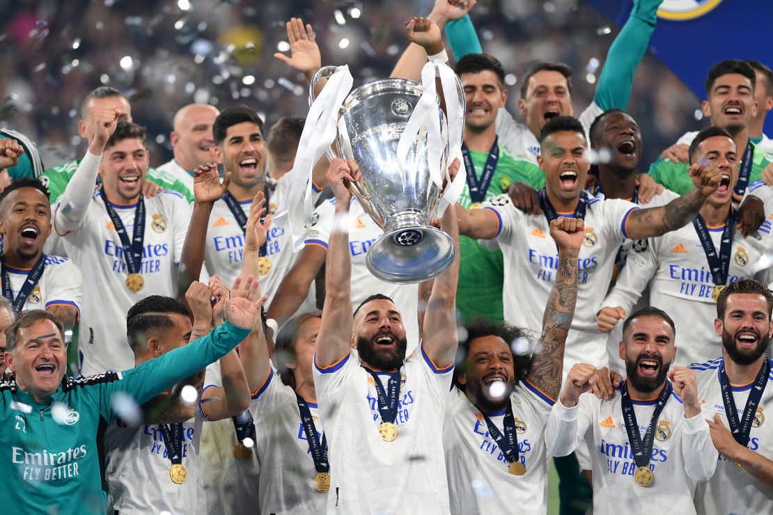 Benzema lifts the UEFA Champions League trophy after Real Madrid beat Liverpool in the final last season. 