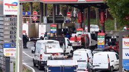 Motorists queue for fuel at a gas station in Paris on October 13, 2022, as filling stations across France are low on petrol as a pay-related strike by workers at energy giant TotalEnergies entered its third week despite government pressure to negotiate. - Striking French oil refinery employees have voted to maintain blockades now in their third week, despite a government order for some of them to return to work in a bid to get fuel supplies flowing. The industrial action to demand pay hikes has paralysed six out of the seven fuel refineries in France, leading to shortages of petrol and diesel exacerbated by panic-buying from drivers. (Photo by Alain JOCARD / AFP) (Photo by ALAIN JOCARD/AFP via Getty Images)