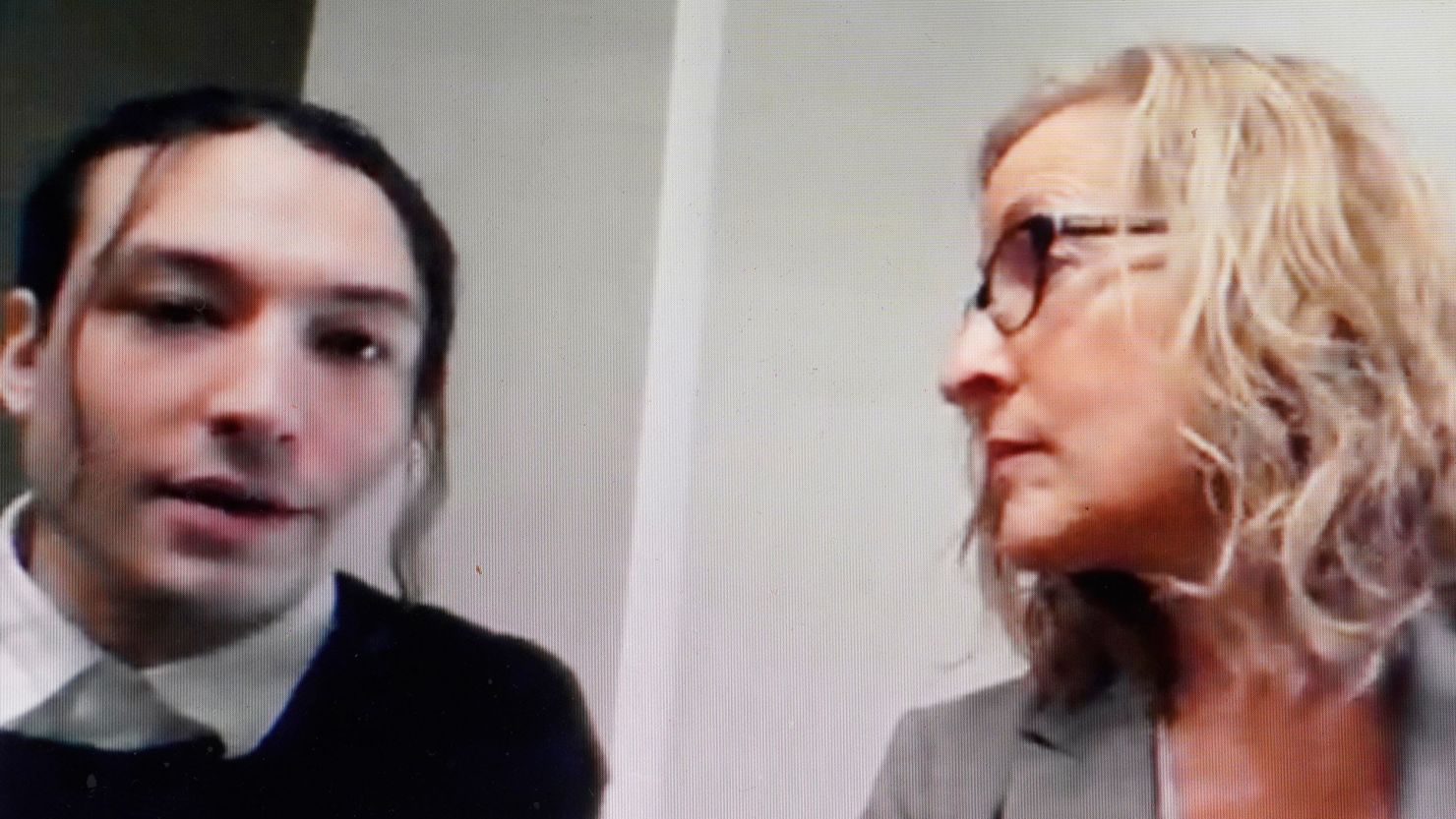 Actor Ezra Miller, left, is seated with attorney Lisa Shelkrot, right, as they appear Monday, Oct. 17, 2022, in a livestream video remotely from Burlington, Vt., during Miller's arraignment at superior court, in Bennington, Vt. Miller has pleaded not guilty to stealing bottles of liquor from a neighbor's home in Vermont. (AP Photo/Steven Senne)