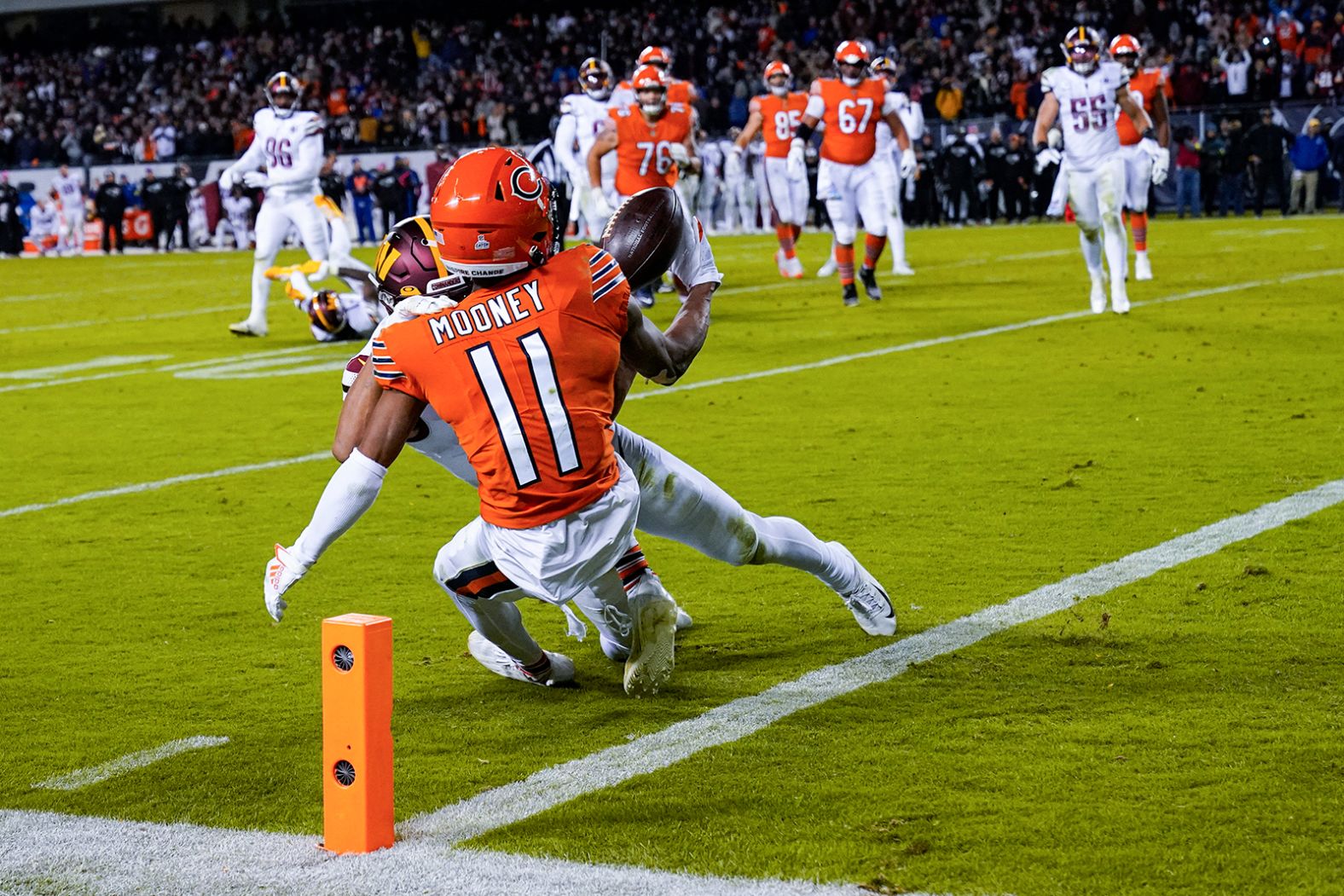 Chicago Bears wide receiver Darnell Mooney makes catch under pressure from Washington Commanders cornerback Benjamin St-Juste just short of the goal line in the final minute of the second half. Mooney came within inches of securing a come-from-behind victory for the Bears, but eventually had to settle for a 12-7 loss after he was adjudged to have landed just short of a touchdown.  