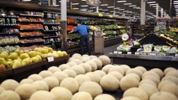 An employee restocks vegetables at a Kroger Co. supermarket in Louisville, Kentucky, U.S., on Tuesday, March 5, 2019. Photographer: Luke Sharrett/Bloomberg