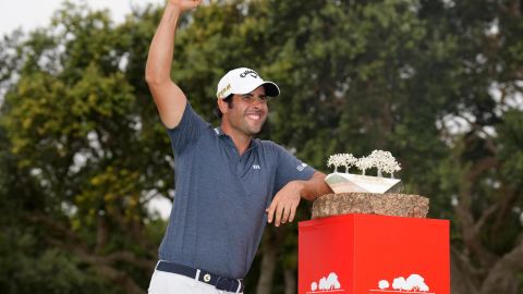 Otaegui celebrates with the trophy.