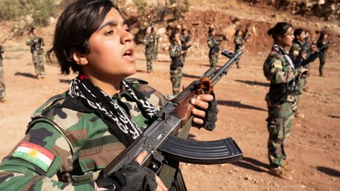 An Iranian Kurdish female militant takes part in military exercises near the Iraq-Iran border.