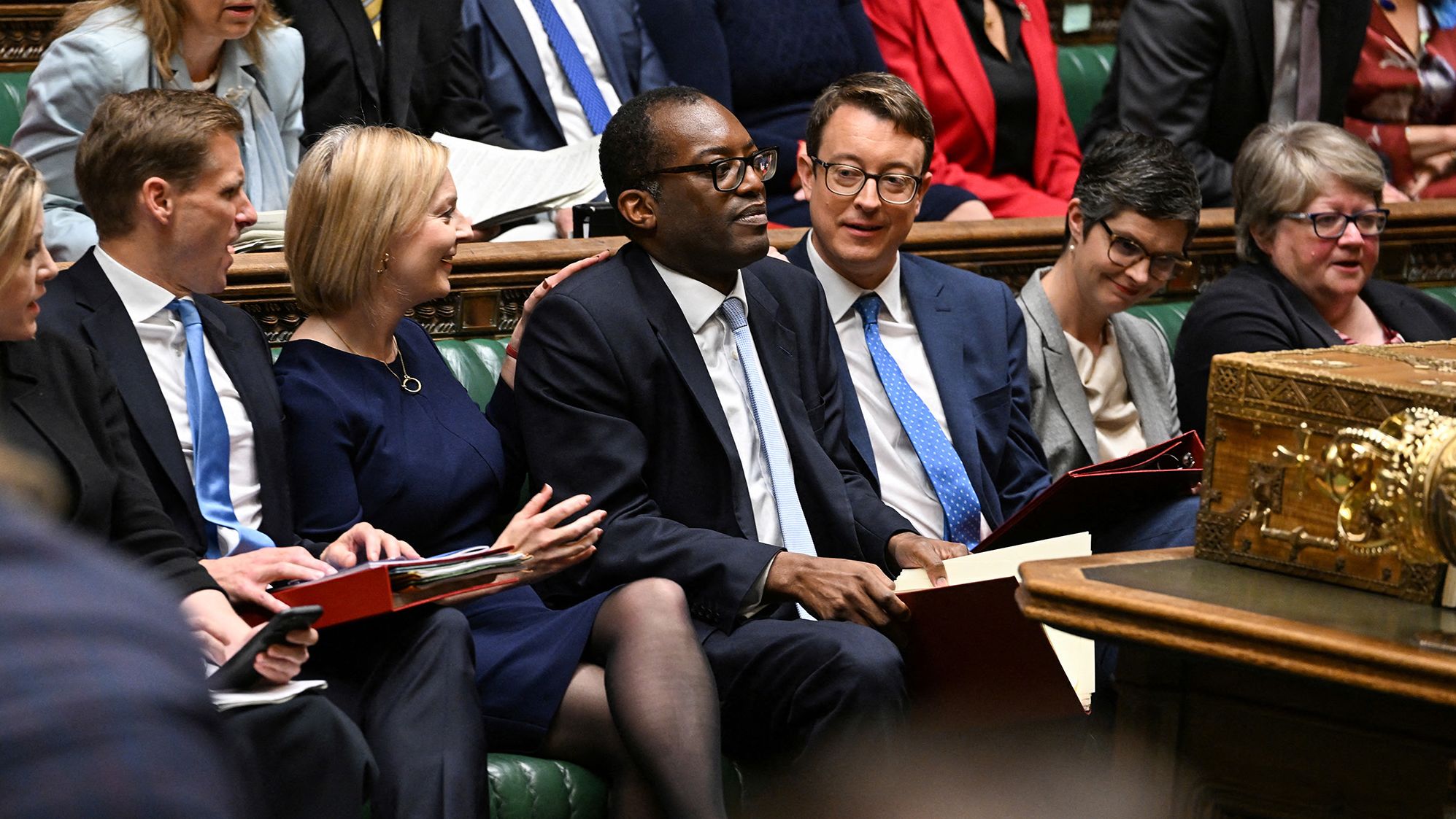 Truss and Chancellor of the Exchequer Kwasi Kwarteng, center, deliver the Government's Growth Plan statement at the House of Commons in September 2022. Kwarteng announced a controversial mini-budget full of unfunded tax-cutting measures <a href="index.php?page=&url=https%3A%2F%2Fwww.cnn.com%2F2022%2F10%2F13%2Fuk%2Fliz-truss-ousting-analysis-intl-gbr%2Findex.html" target="_blank">that sent financial markets into meltdown.</a> At one point, the pound sank to its lowest level against the dollar in decades. He was relieved of his duties weeks later.