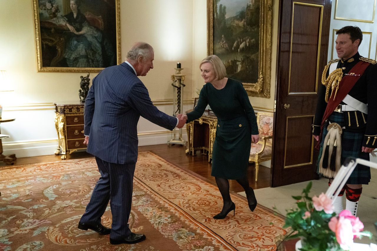 Britain's King Charles III shakes hands with Truss during a weekly audience at Buckingham Palace in October 2022.