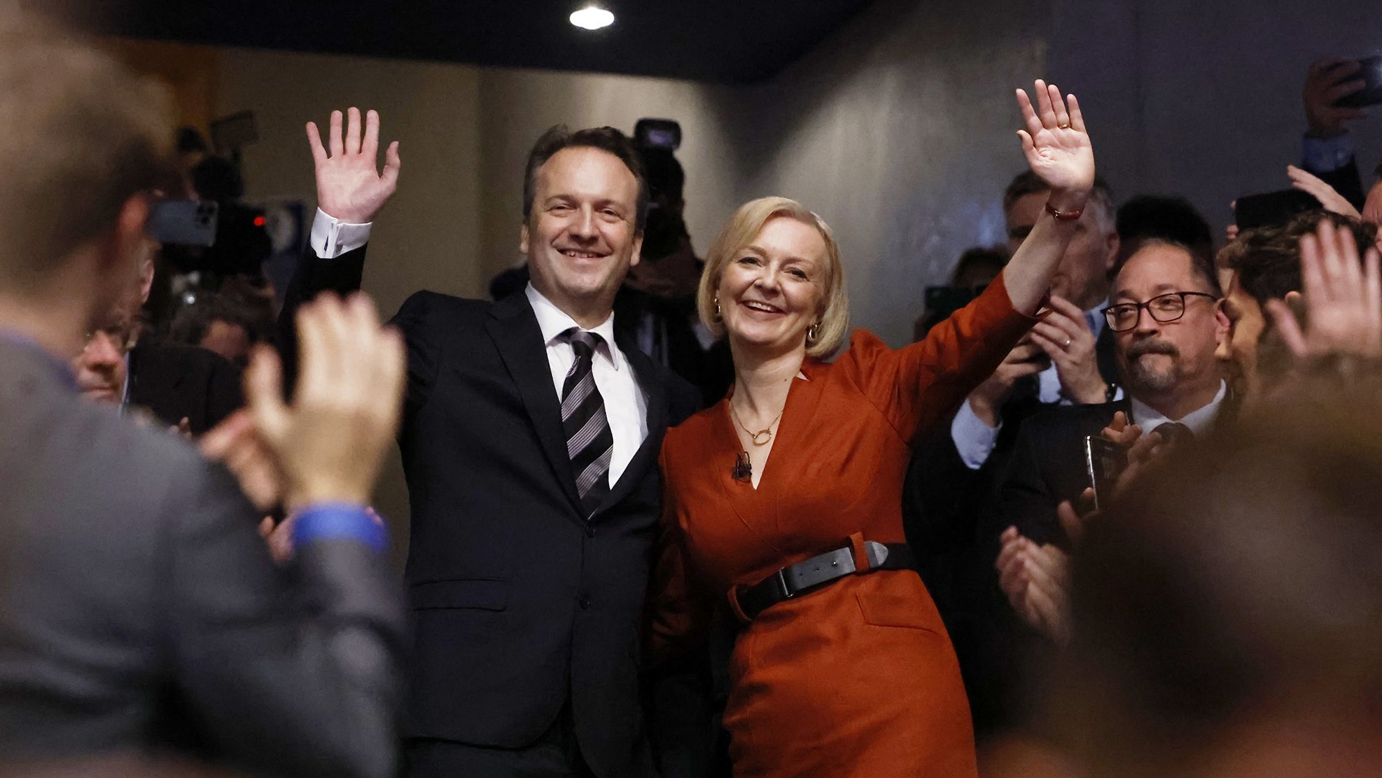 Truss poses with her husband, Hugh O'Leary, after speaking at the Conservative Party Conference in Birmingham, England, in October 2022.