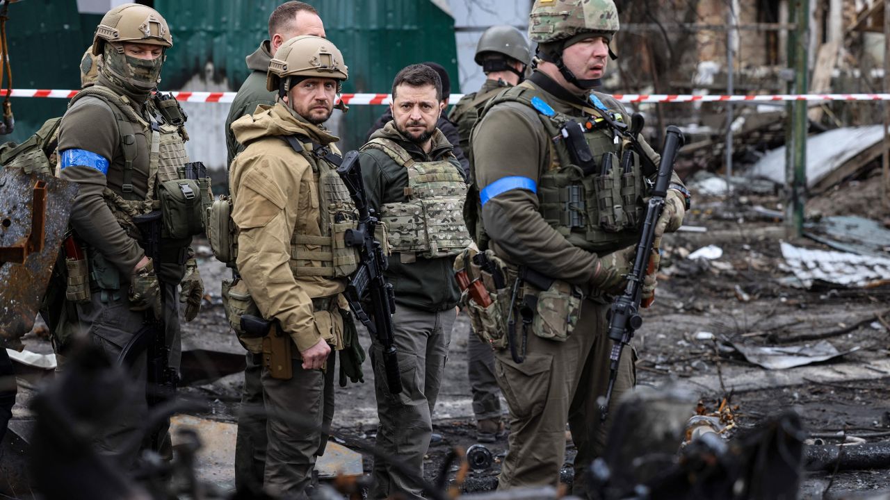 President Volodymyr Zelensky, center, visits the town of Bucha, where civilian bodies were found in the street after the town was retaken from Russia by the Ukrainian army. Zelensky has given a master class in effective war leadership, military historians say.