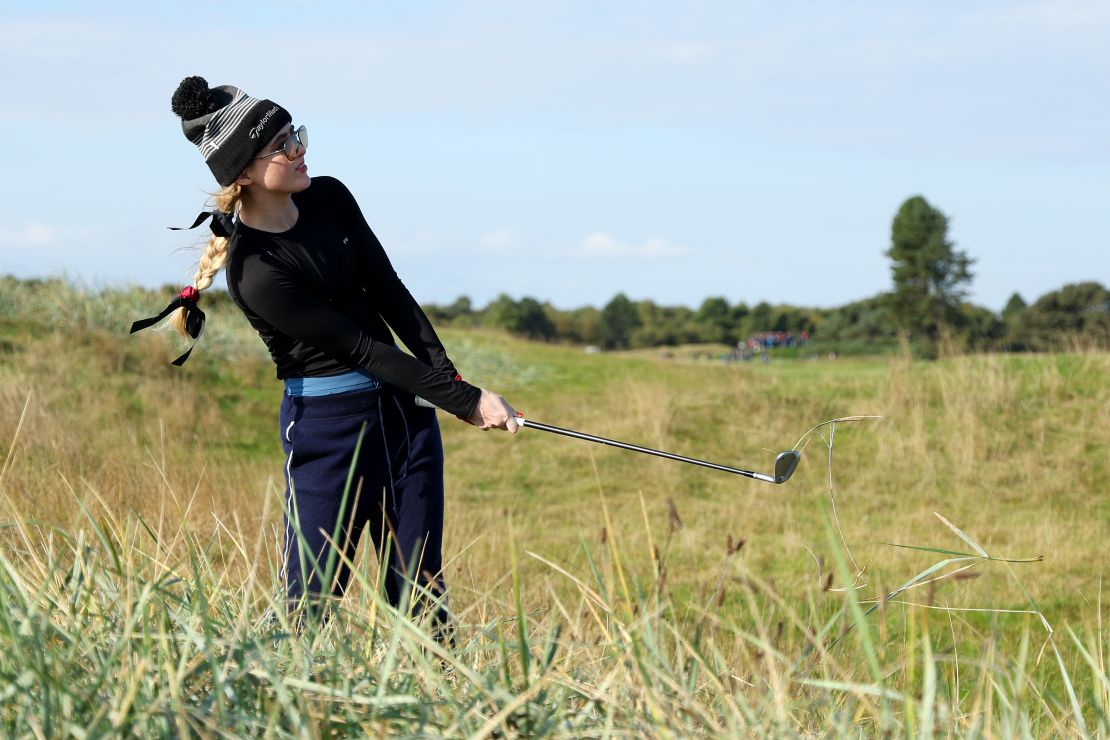 Newton plays out of the rough at St. Andrews.