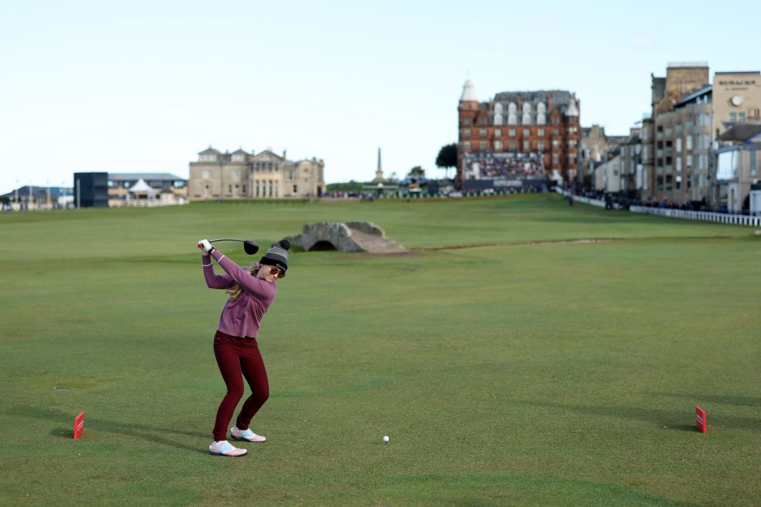 Newton drives down the famous 18th fairway at St. Andrews.