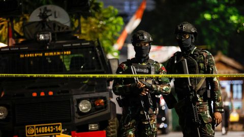 Police officers stand guard outside Ferdy Sambo's house
during a raid in Jakarta.