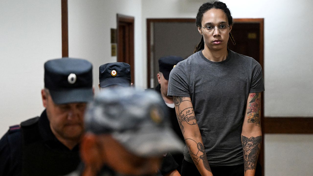 U.S. basketball player Brittney Griner, who was detained at Moscow's Sheremetyevo airport and later charged with illegal possession of cannabis, is escorted in a court building in Khimki outside Moscow, Russia August 4, 2022. Kirill Kudryavtsev/Pool via REUTERS