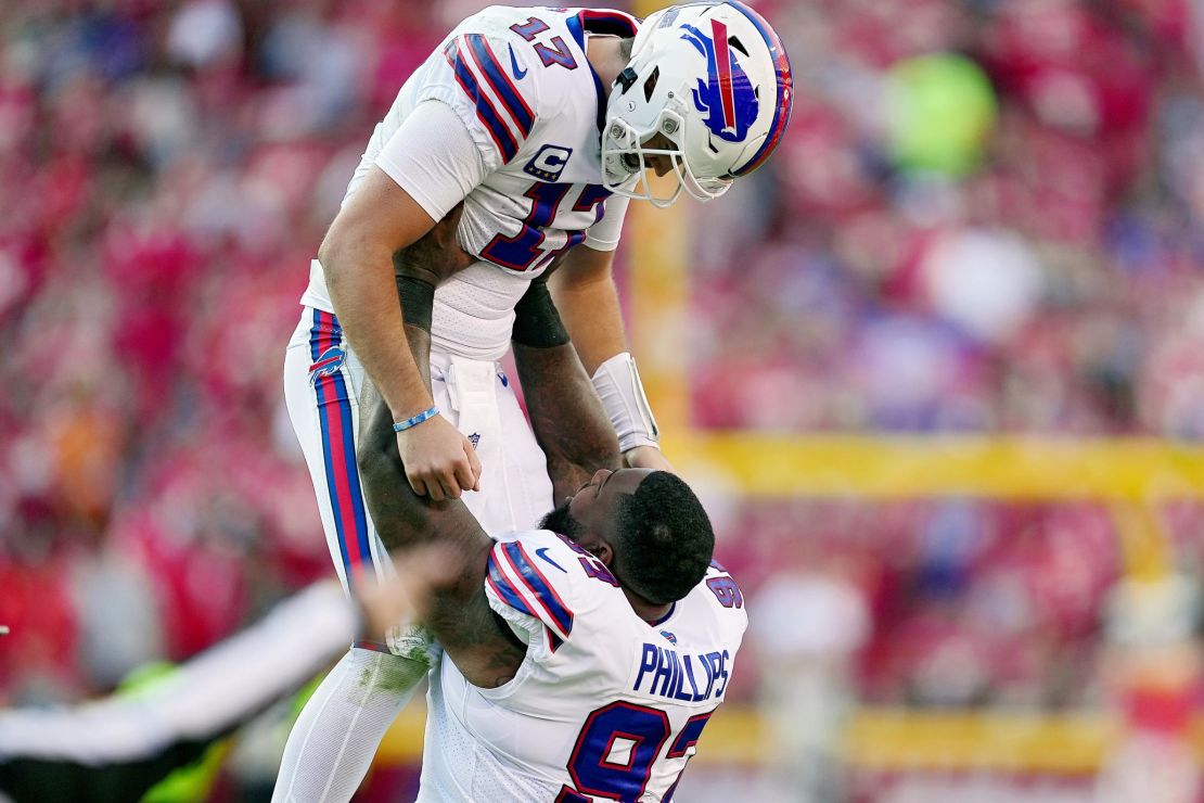 Allen celebrates a touchdown with teammate Jordan Phillips against the Chiefs.