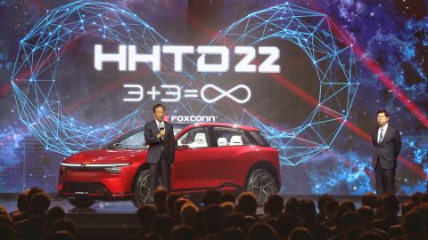 Foxconn Technology Group founder Terry Gou, left, unveils the Model B crossover at an event in Taipei, Taiwan.