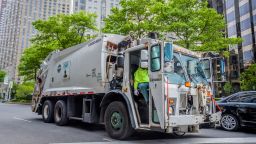 MANHATTAN, NEW YORK, UNITED STATES - 2020/05/24: A garbage truck driving around the almost empty streets of Manhattan. (Photo by Erik McGregor/LightRocket via Getty Images)