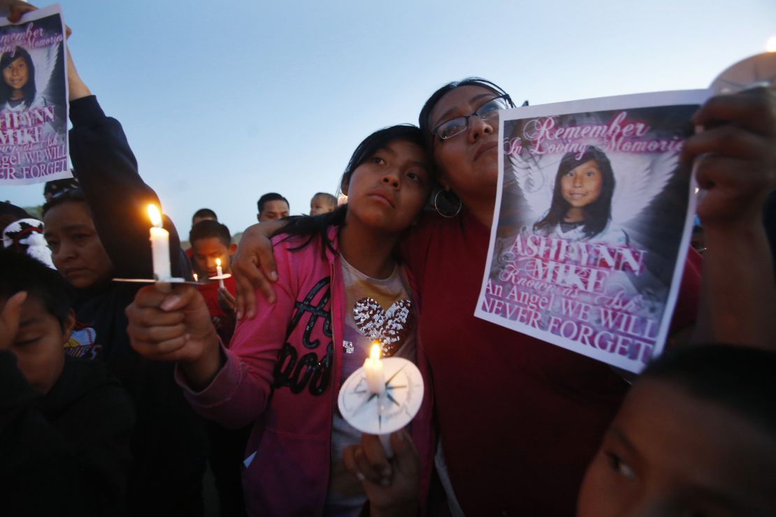 In this May 4, 2016 photo, Klandre Willie, left, and her mother, Jaycelyn Blackie, participate in a candlelight vigil in Lower Fruitland, New Mexico, for Ashlynne Mike, who was abducted and left to die in a remote spot on the Navajo Nation. (Jon Austria/The Daily Times via AP, File)