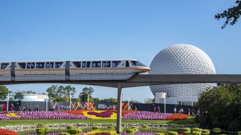 A monorail train zips past flower displays at Epcot, one of the four big theme parks at Walt Disney World Resort in Florida.