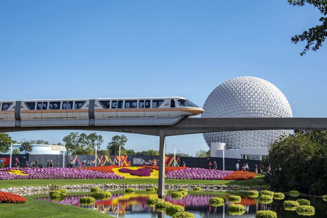 A monorail train zips past flower displays at Epcot, one of the four big theme parks at Walt Disney World Resort in Florida.