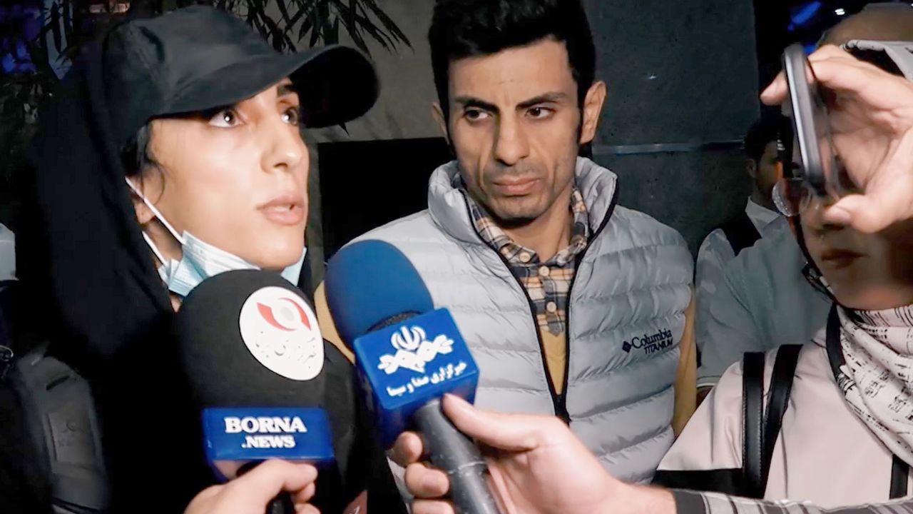 Editorial use only. HANDOUT /NO SALESMandatory Credit: Photo by BORNA NEWS AGENCY HANDOUT/EPA-EFE/Shutterstock (13477358a)A grab from a handout video made available by Borna News Agency for Iranian competitive climber Elnaz Rekabi speaking to journalists upon her arrival at the Imam Khomeini International Airport in Tehran, Iran, 19 October 2022. Rekabi returned to Tehran after competing in South Korea without wearing a mandatory headscarf required for Iranian female athletes from the Islamic Republic. Rekabi has described her not wearing a hijab as unintentional act as she was in rush to prepare for competition, and apologized for that.Iranian competitive climber Elnaz Rekabi returns home, Tehran, Iran Islamic Republic Of - 19 Oct 2022