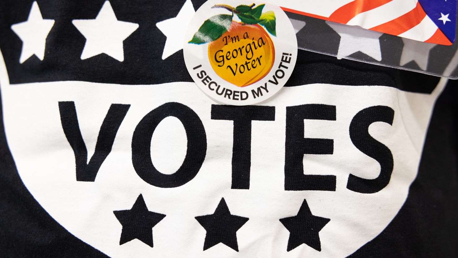 A poll worker wears an "I'm a Georgia Voter" sticker at the Metropolitan Library polling location on May 24, 2022 in Atlanta, Georgia. 