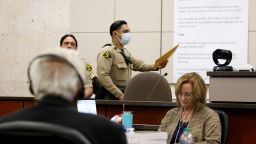 A bailiff hands the judge an envelope from the jury during Ruben Flores' trial in Monterey County Superior Court on Tuesday, Oct. 18, 2022, in Salinas, Calif. The jury acquitted Flores of helping his son, Paul Flores, cover up the murder of Cal Poly student Kristin Smart.