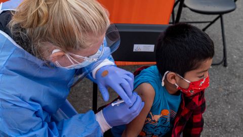 A health care worker administers a Pfizer/BioNTech Covid-19 vaccine to a child at a vaccination site in San Francisco on January 10.