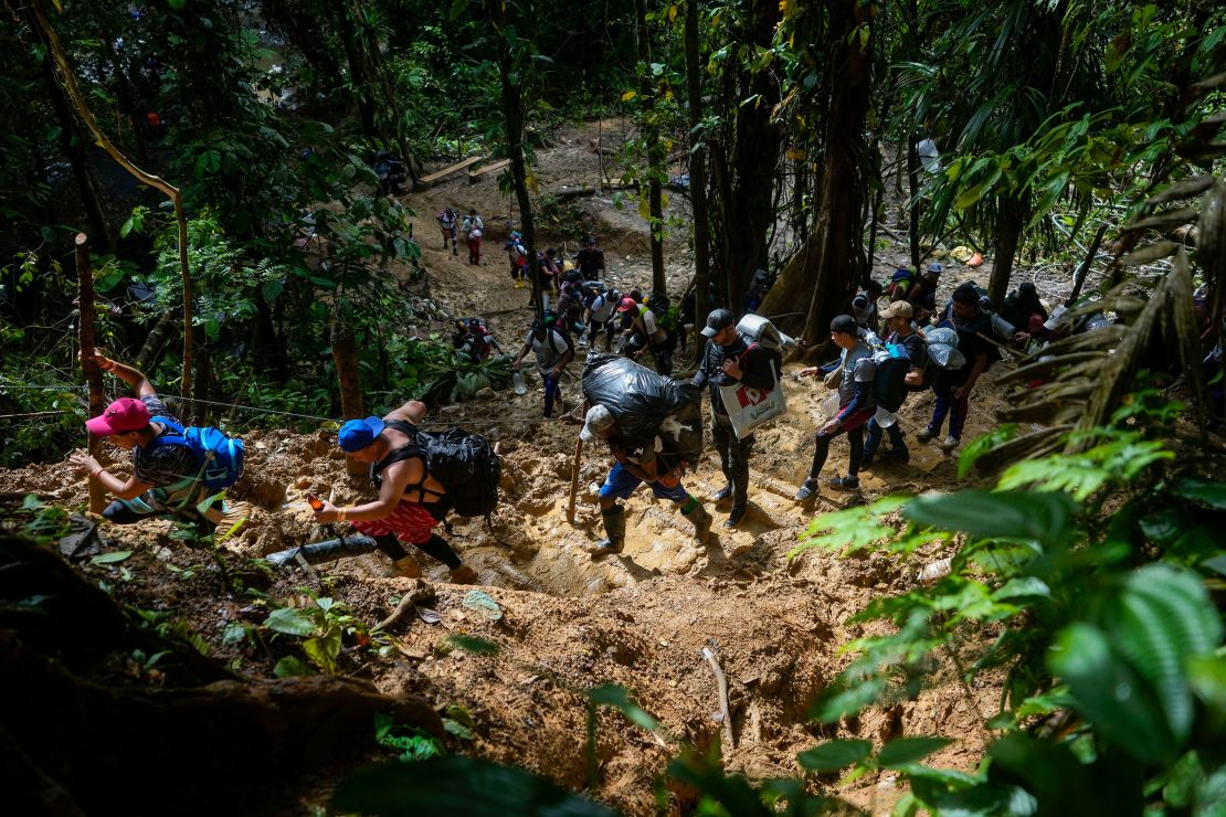 Migrants, mostly Venezuelans, trek across the Darien Gap from Colombia into Panama on October 15, 2022, on their way towards the US. 