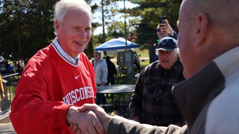 Sen. Ron Johnson greets people during a campaign stop at the Moose Lodge Octoberfest celebration earlier this month in Muskego, Wisconsin. 