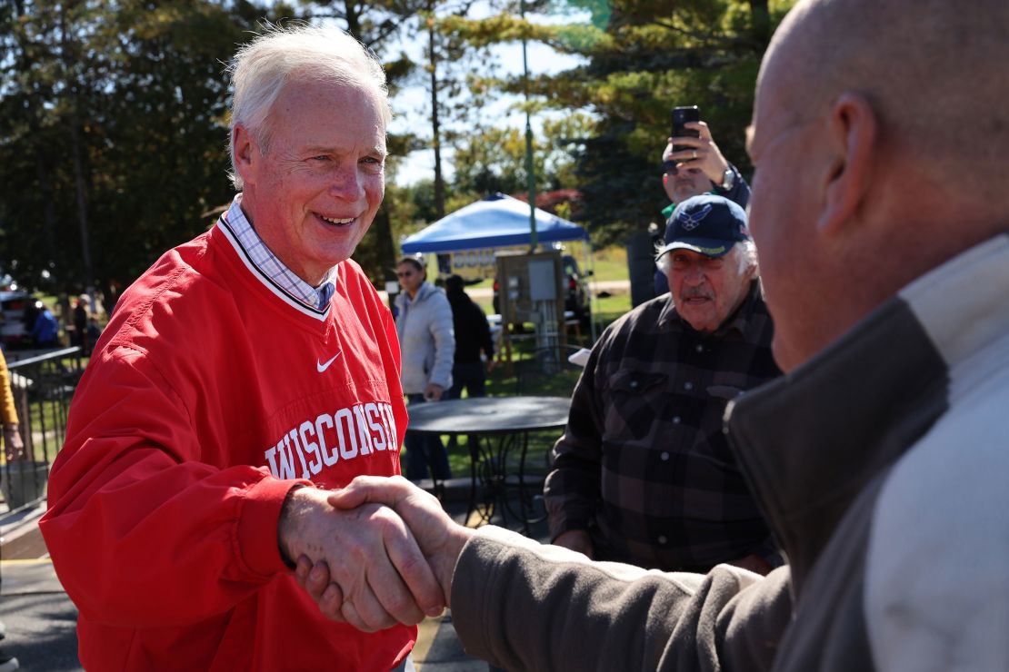Sen. Ron Johnson greets people during a campaign stop at the Moose Lodge Octoberfest celebration earlier this month in Muskego, Wisconsin. 