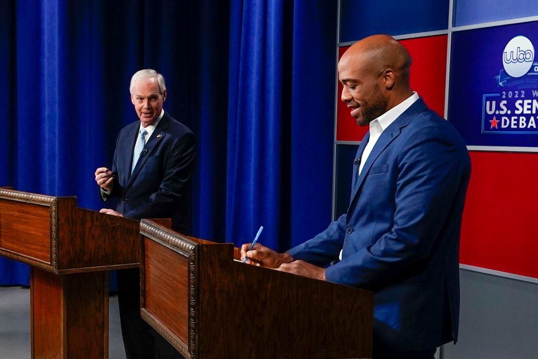 Sen. Ron Johnson, a Republican from Wisconsin, at left, and his Democratic challenger Mandela Barnes take notes before a televised debate earlier this month in Milwaukee. 