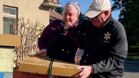 A Massachusetts woman who unleashed bees on deputies tussles with a Hampden County Sheriff's deputy on October 12, 2022.