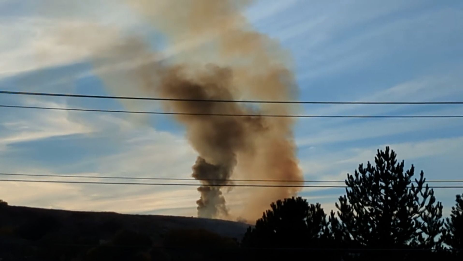 Smoke rises following an F-35 crash at Hill Air Force Base.