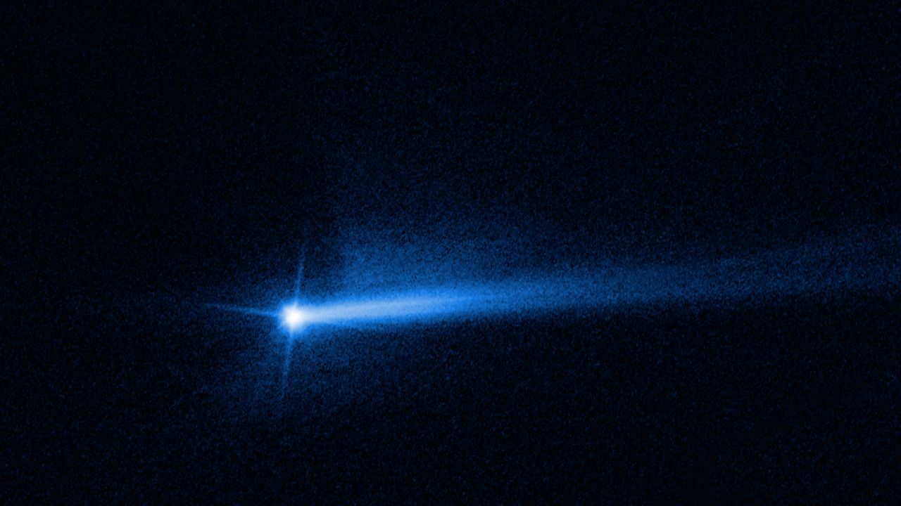Two tails of dust ejected from the Didymos-Dimorphos asteroid system are visible in an image from the Hubble Space Telescope, showing the aftermath of the DART mission's impact with Dimorphos.