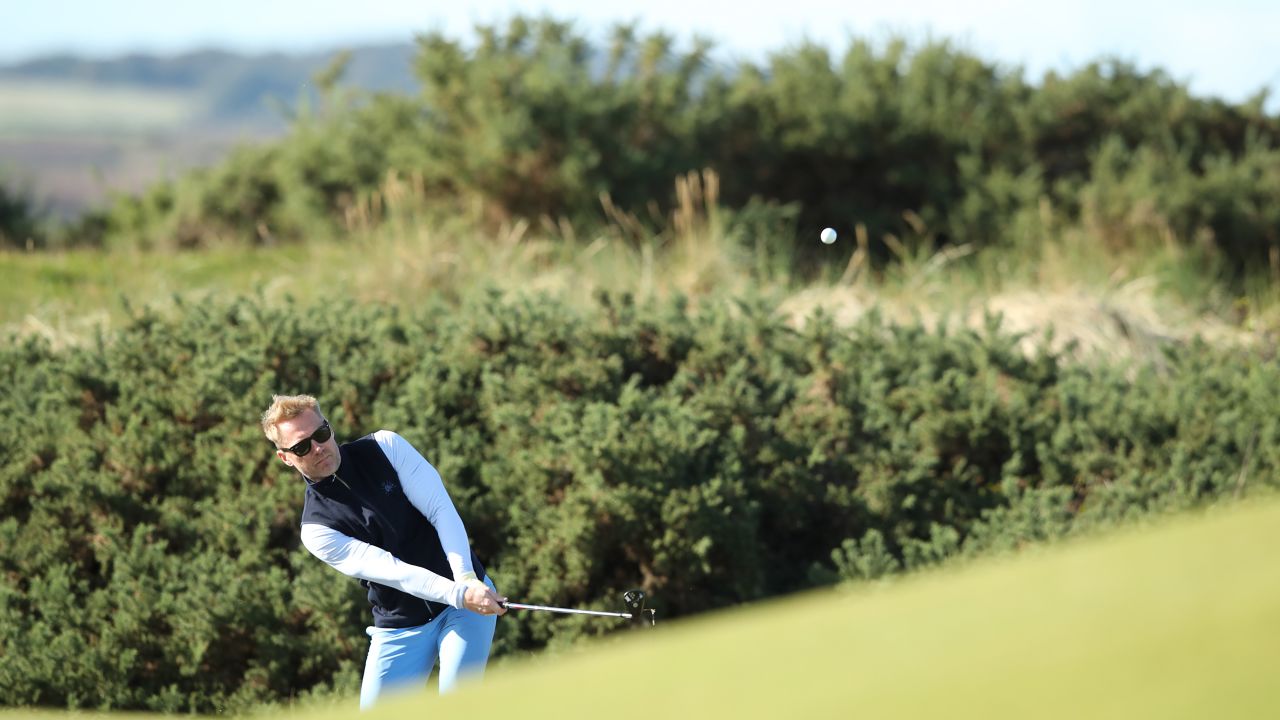 Keating shoots towards the 5th hole of the Old Course.