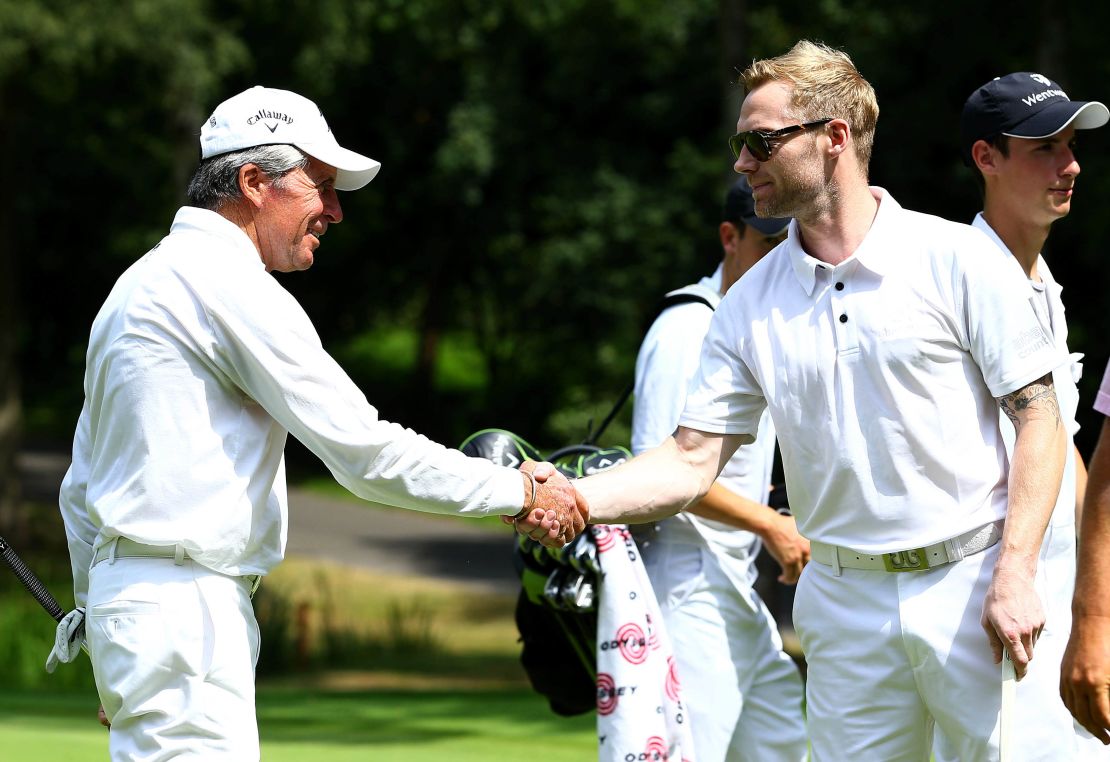 Player greets Keating during the Gary Player Invitational at Wentworth Golf Club, England in 2013.