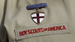 FILE - A close up of a Boy Scout uniform is photographed on Feb. 4, 2013, in Irving, Texas. A Delaware bankruptcy judge has approved a $2.46 billion reorganization plan Thursday, Sept. 8, 2022, proposed by the Boy Scouts of America that would allow it to continue operating while compensating tens of thousands of men who say were sexually abused as children while involved in Scouting. (AP Photo/Tony Gutierrez, File)