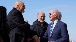 President Joe Biden speaks with Pennsylvania Lt. Gov. John Fetterman, a Democratic candidate for U.S. Senate, after stepping off Air Force One, Thursday, Oct. 20, 2022, at the 171st Air Refueling Wing at Pittsburgh International Airport in Coraopolis, Pa. Biden is visiting Pittsburgh to promote his infrastructure agenda. 