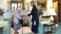 ABERDEEN, SCOTLAND - SEPTEMBER 06: Queen Elizabeth greets newly elected leader of the Conservative party Liz Truss as she arrives at Balmoral Castle for an audience where she will be invited to become Prime Minister and form a new government on September 6, 2022 in Aberdeen, Scotland. The Queen broke with the tradition of meeting the new prime minister and Buckingham Palace, after needing to remain at Balmoral Castle due to mobility issues. (Photo by Jane Barlow - WPA Pool/Getty Images)