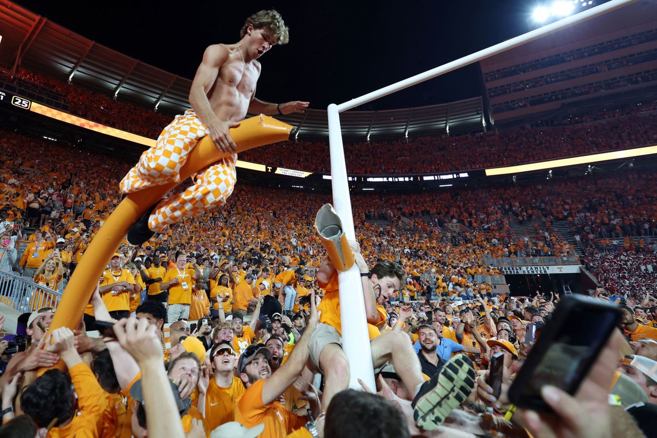 Tennessee Volunteers fans tear down the goal post after storming the field when their team defeated the Alabama Crimson Tide in Knoxville, Tennessee, on Saturday, October 15. Tennessee <a href=