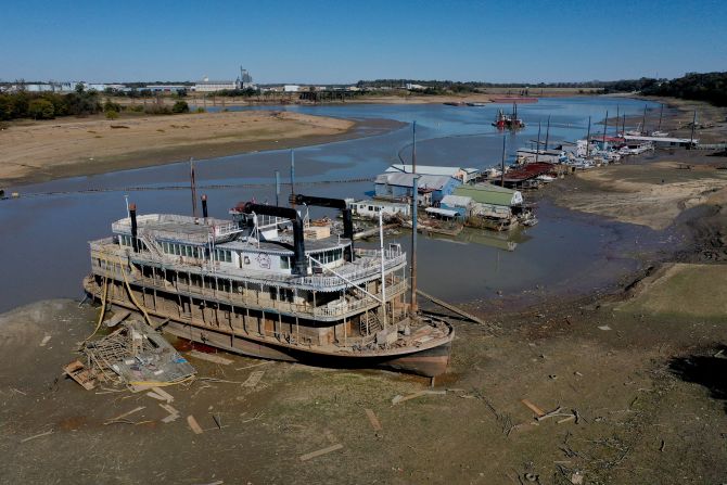 The Diamond Lady, a once majestic riverboat, rests with smaller boats in mud along the Mississippi River in Memphis, Tennessee, on Wednesday, October 19.  Severe drought across the Midwest has shrunk the<a href="index.php?page=&url=https%3A%2F%2Fwww.cnn.com%2F2022%2F10%2F07%2Fbusiness%2Fmississippi-river-closures-grounded-barges-drought-climate%2Findex.html" target="_blank"> Mississippi to record lows.</a>