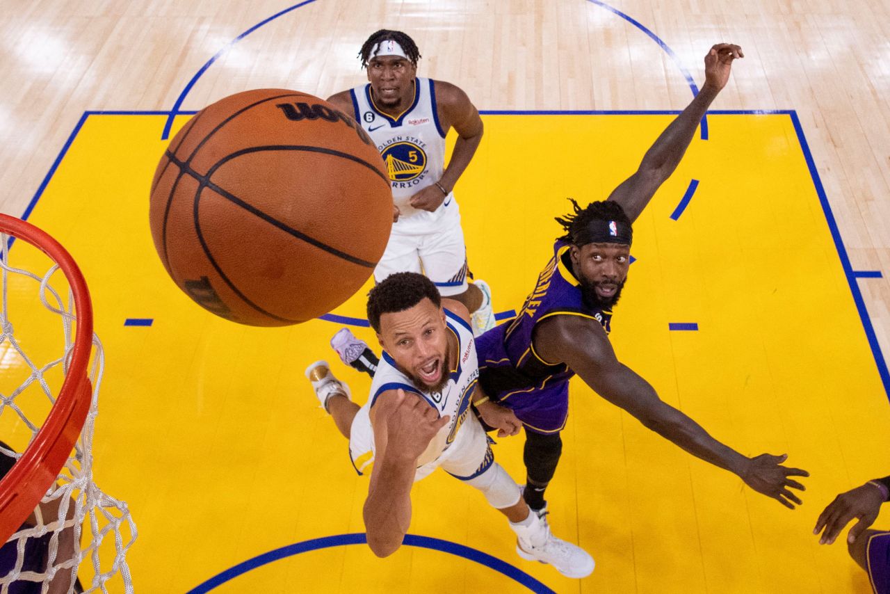Steph Curry of the Golden State Warriors takes a shot against Los Angeles Lakers guard Patrick Beverley during the second half of a game at Chase Center in San Francisco on Tuesday, October 18. The Warriors won 123-109.